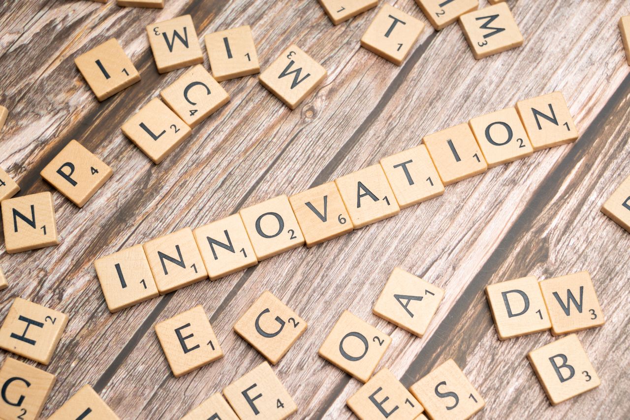 Crafting Captivating Headlines: Your awesome post title goes here Creative display of 'Innovation' spelled with wooden letter tiles on a wooden surface.